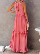 Laila halter ruffle maxi dress in apricot by Lumina Vancouver, featuring a flowing silhouette and elegant ruffle details.