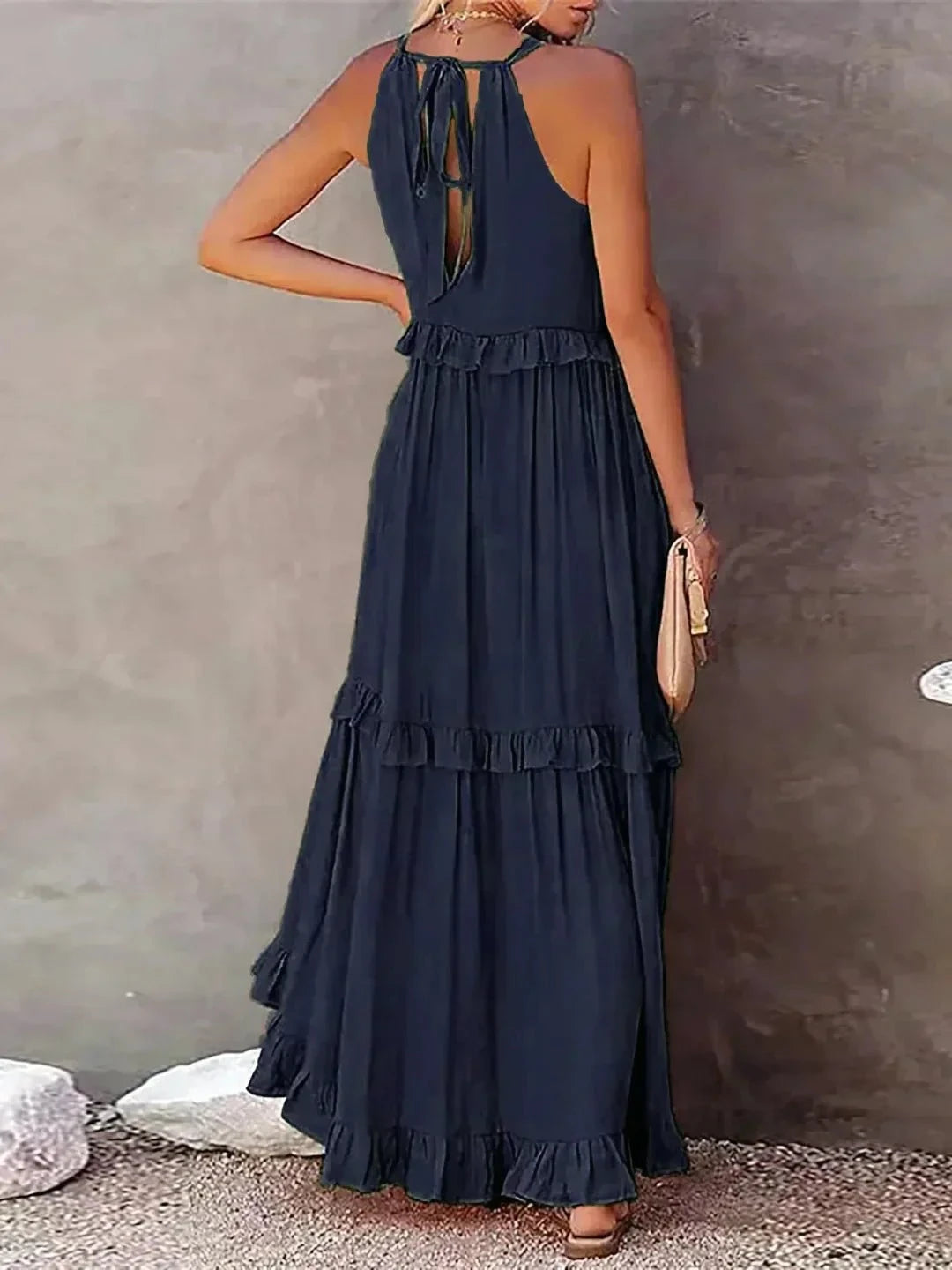 Laila halter ruffle maxi dress in apricot by Lumina Vancouver, flowing fabric with ruffle details, stylish for summer wear.