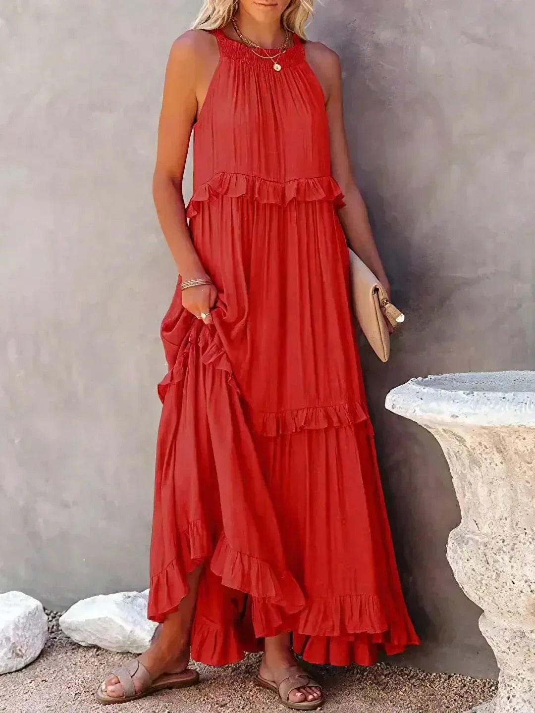 Laila halter ruffle maxi dress in apricot by Lumina Vancouver, featuring flowing fabric and elegant design.