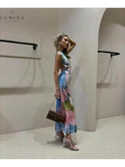 Elegant Emilia Maxi Dress by Lumina Vancouver, perfect for wedding guests, featuring flowing fabric and stylish design.