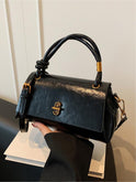 Black Lumina Wear Emma satchel handbag with versatile design and optional crossbody strap, stylish and functional for everyday use.