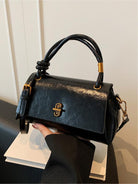 Black Lumina Wear Emma chic versatile satchel with crossbody strap, stylish handbag featuring sleek design and carry options.