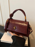 Black Lumina Wear Emma chic versatile satchel handbag with optional crossbody strap, stylish and spacious for everyday use.