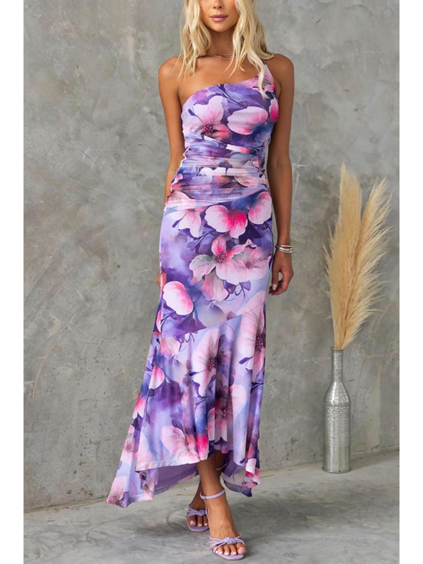 Blue floral summer dress by Lumina Wear, Zelie style, featuring lightweight fabric and elegant design for warm-weather occasions.