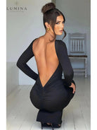 Evanna boat-neck backless maxi dress by Lumina Vancouver, shown in size XS with flowing fabric and elegant design.