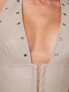 Tan faux leather corset tank top from Lumina Vancouver, featuring a fitted design and structured bust detail.