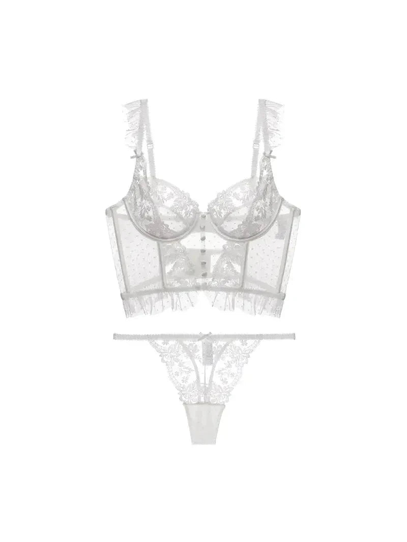 White Lovise Italian lingerie set by Lumina Vancouver featuring delicate lace and soft fabric, displayed on a model.