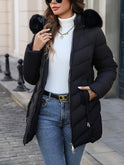 Black Lumina Wear Florence quilted puffer coat with faux-fur hood, stylish winter coat with a cozy, padded design.