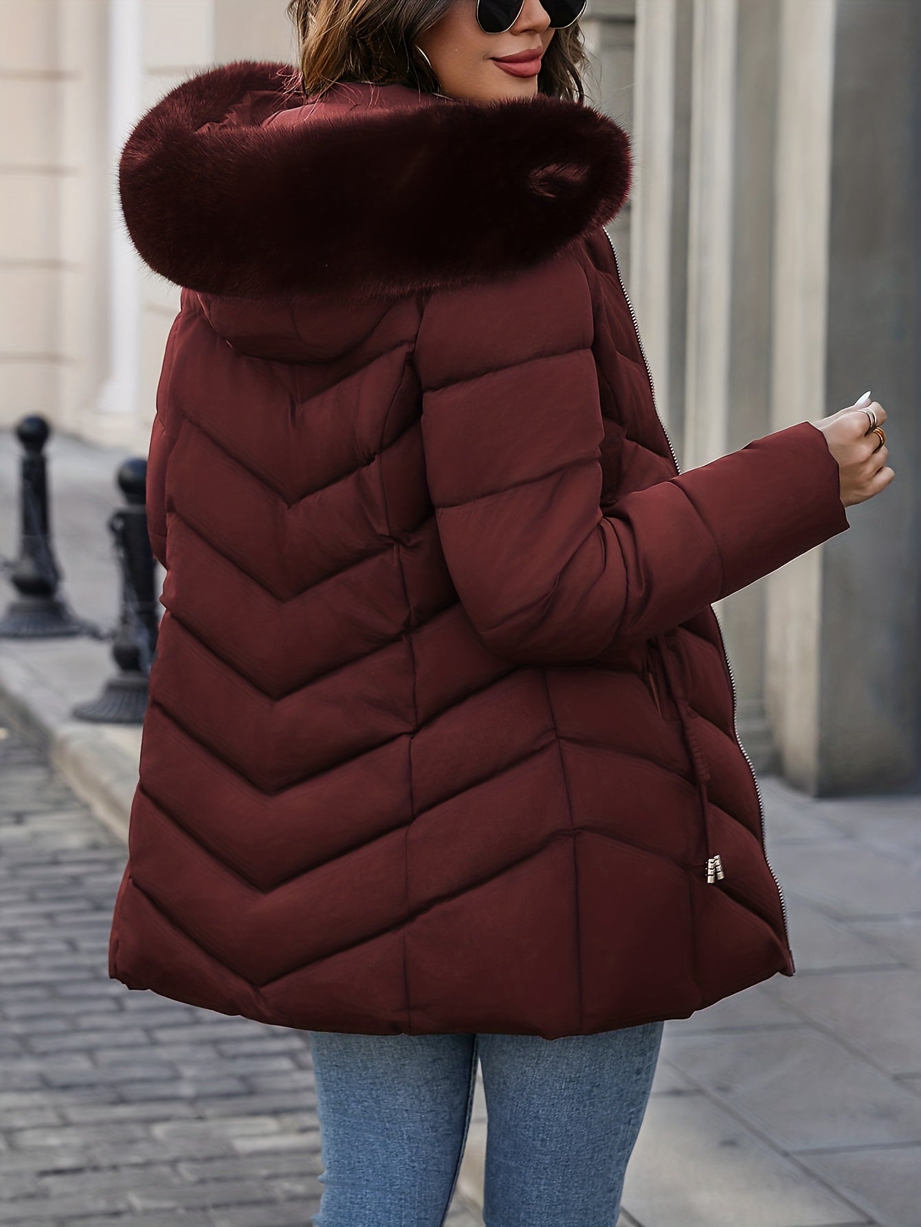 Black Lumina Wear Florence quilted puffer coat with faux-fur hood, stylish and warm winter outerwear for women.