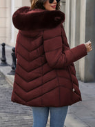 Black Lumina Wear Florence quilted puffer coat with faux-fur hood, stylish and warm winter outerwear for women.