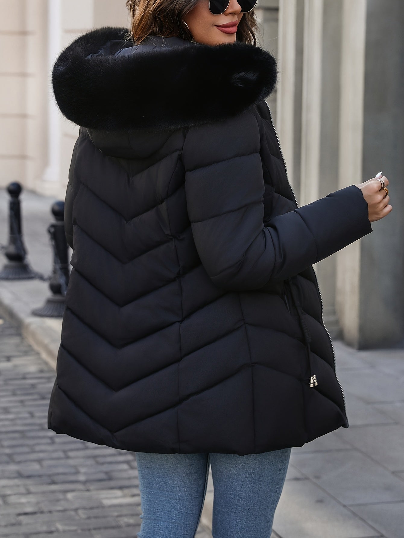 Black Florence Lumina Wear quilted puffer coat with faux-fur hood, stylish and warm winter outerwear for women.