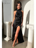 Lumina Wear Florencia halterneck sleeveless slit maxi dress in burgundy, perfect for wedding guests, shown on a model.