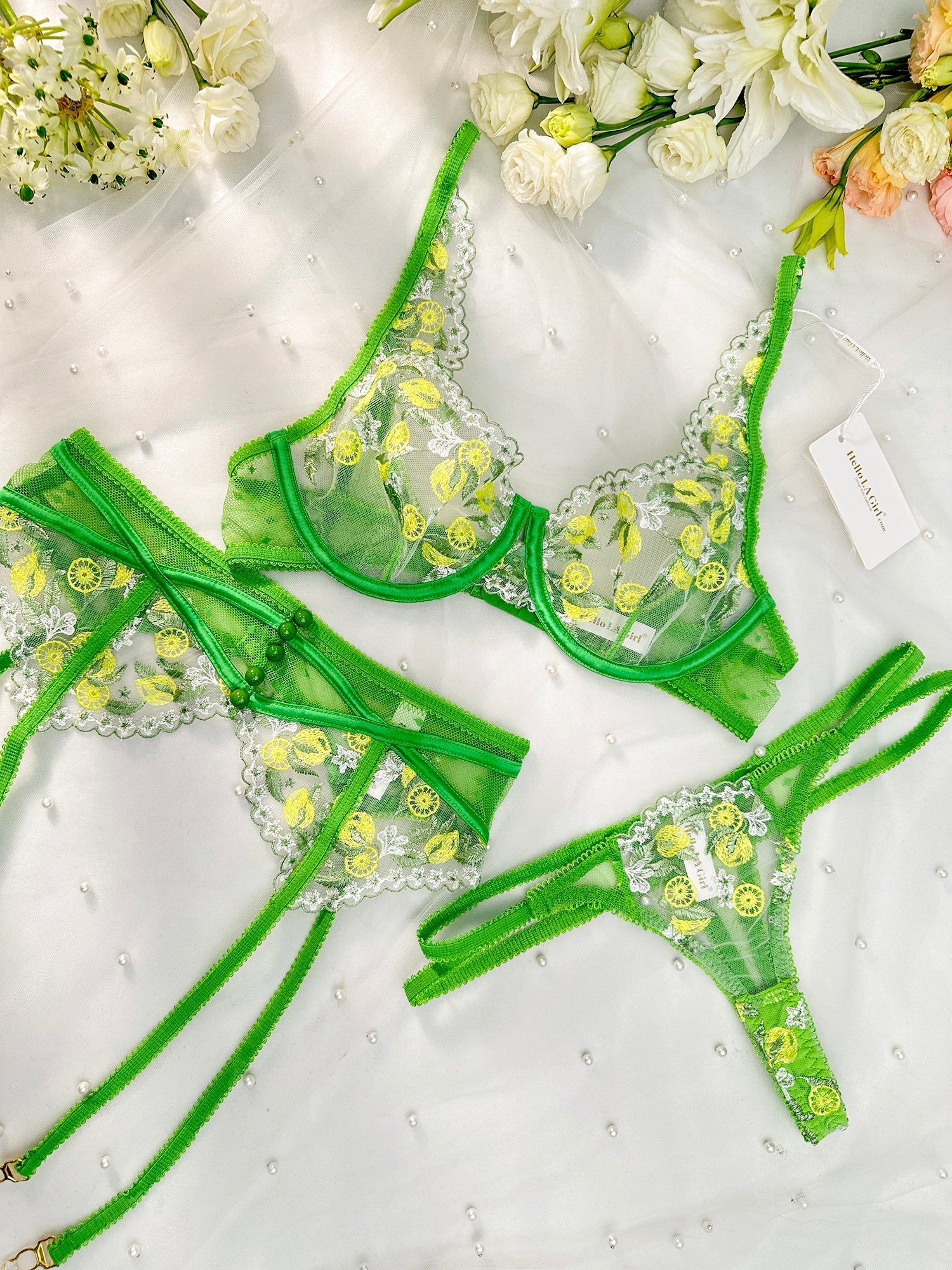 Fresh lemon embroidery lingerie set by Lumina Vancouver, 3-piece green satin and lace bra, panties, and camisole.