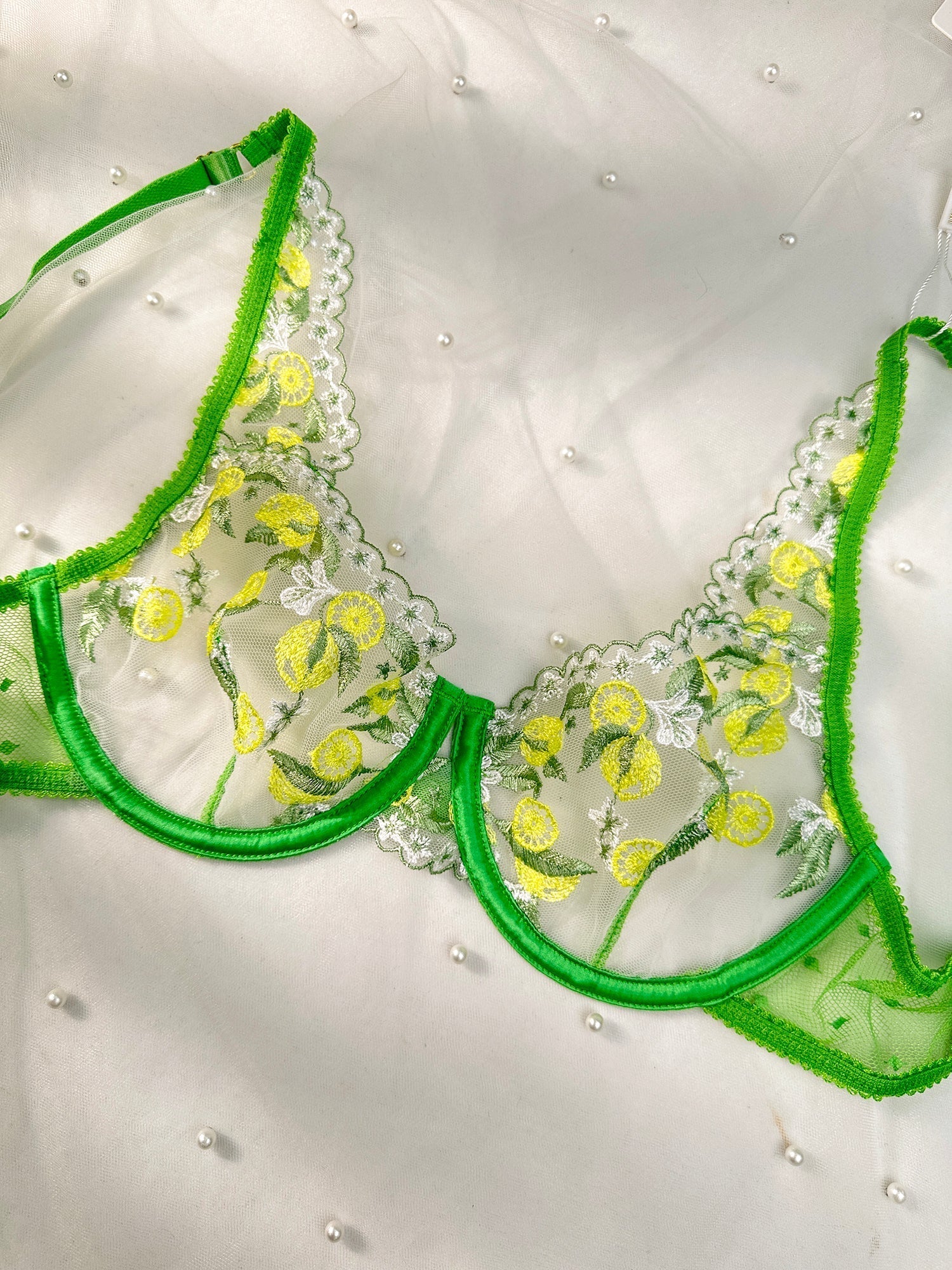Fresh lemon embroidery lingerie set by Lumina Vancouver, 3-piece green lingerie set with detailed embroidery and matching bras and panties.