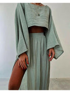 Green Laure Two-Piece Set by Lumina Vancouver featuring a stylish top and matching pants on a model.