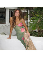 Green Gaia flower dress by Lumina Vancouver, perfect for holiday vibes, featuring a floral design and lightweight fabric.