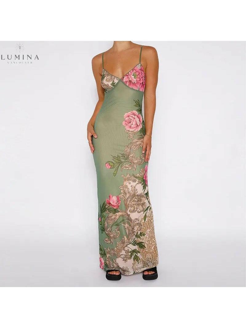 Green Gaia Flower Dress by Lumina Vancouver, perfect for holiday vibes, featuring floral patterns and a flowing design.