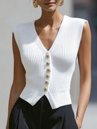 White Genevieve knit button vest top with peplum hem from Lumina Vancouver, styled as a cardigan, shown in XS size.
