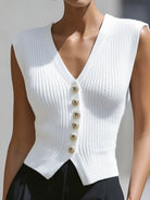 White Genevieve knit button vest top with peplum hem, styled as a cardigan, by Lumina Vancouver.