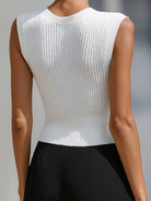 White Genevieve knit button vest top with peplum hem, styled as a cardigan by Lumina Vancouver.