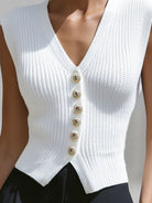 Lumina Vancouver Genevieve knit button vest top with peplum hem in white, styled as a cardigan, displayed on a model.