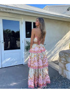 Lumina Vancouver Ghita maxi summer dress, elegant wedding guest gown with flowing fabric and floral design.