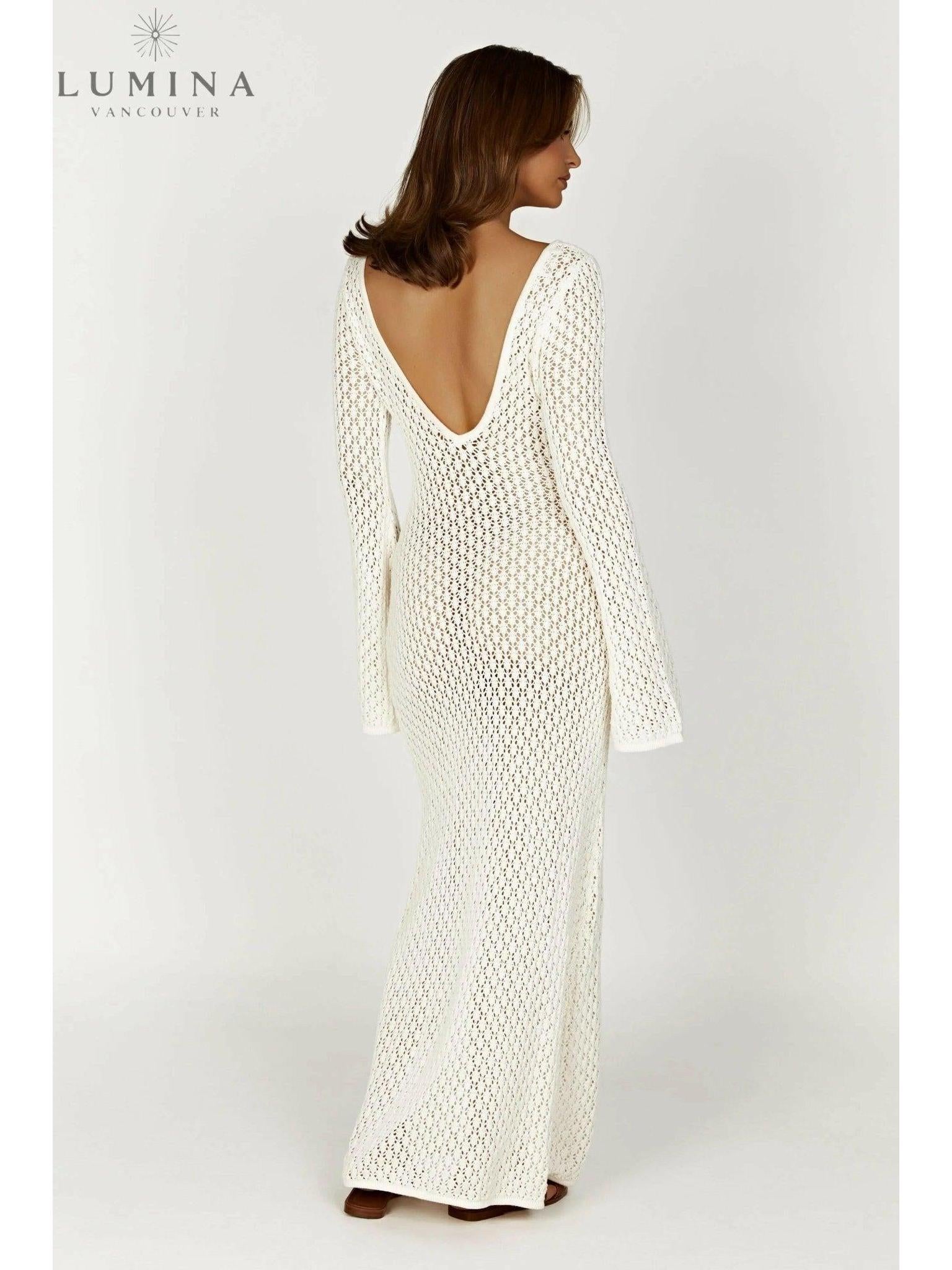 Elegant white Giana dress by Lumina Vancouver, perfect for holiday vibes, shown on a model with stylish details.