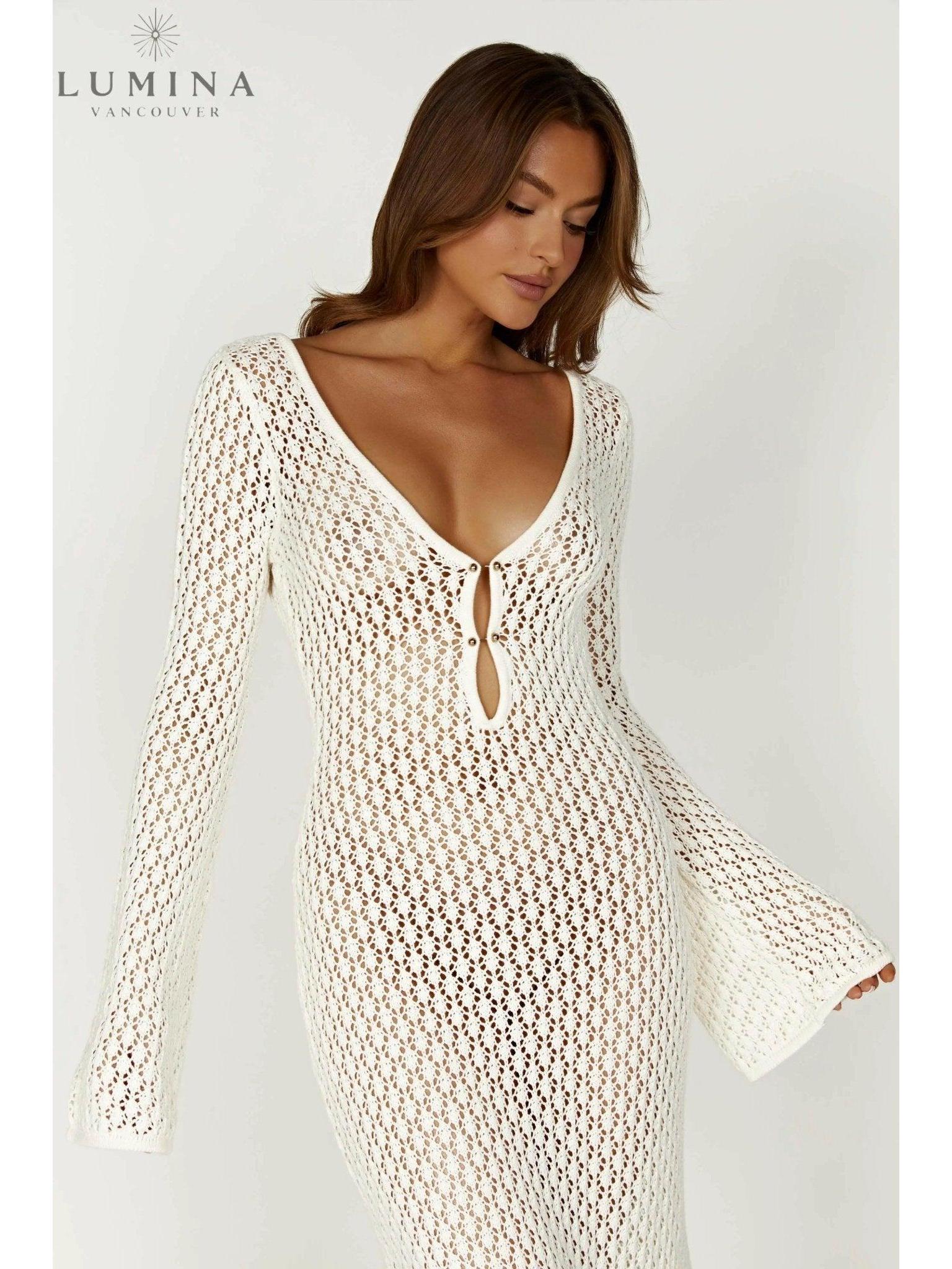 Elegant white Giana dress by Lumina Vancouver, perfect for holiday vibes, shown on a model with a flowing design and stylish details.