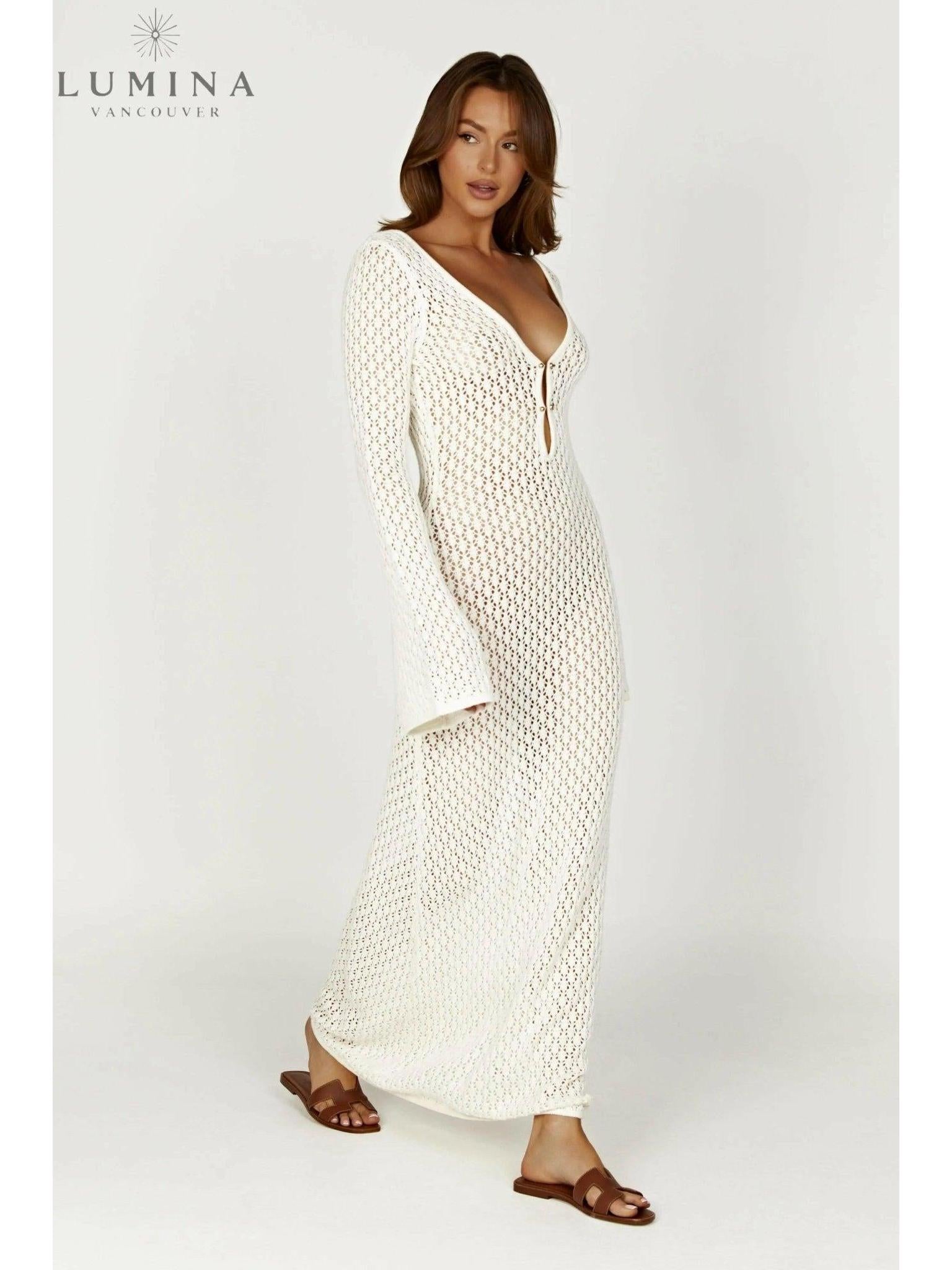 Elegant white Giana dress by Lumina Vancouver, perfect for holiday vibes, shown on a model with stylish accessories.