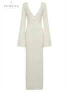 Elegant white Giana dress by Lumina Vancouver, perfect for holiday vibes, showcased on a model in a stylish setting.