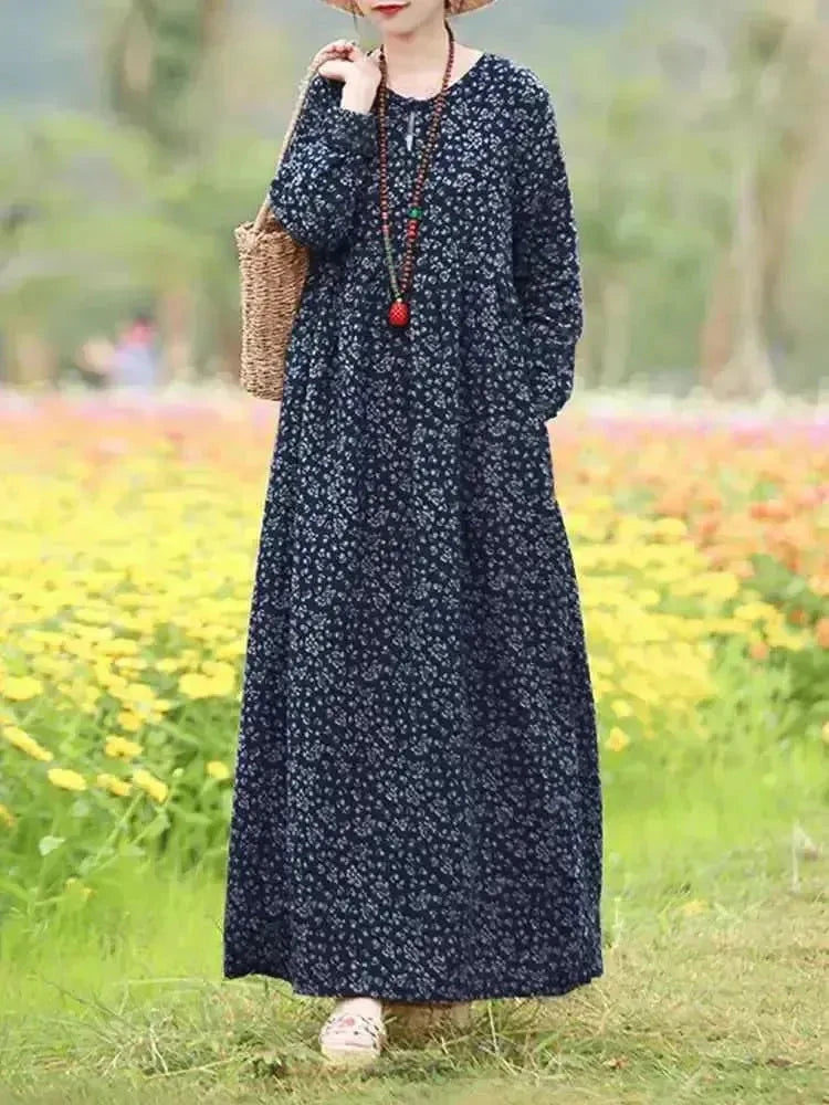 Giorgia vintage floral printed dress by Lumina Vancouver featuring a blue floral pattern and a feminine, flowy design.