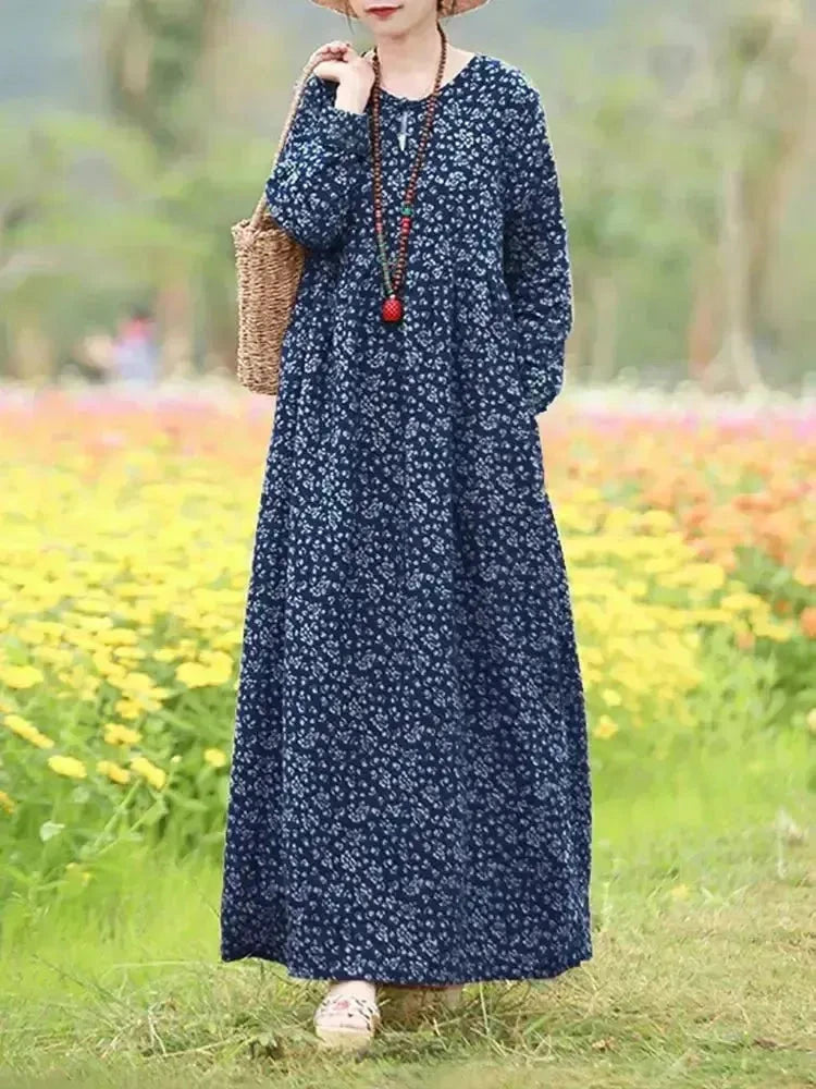 Giorgia vintage floral printed dress by Lumina Vancouver, showing a blue dress with a classic floral pattern and feminine silhouette.