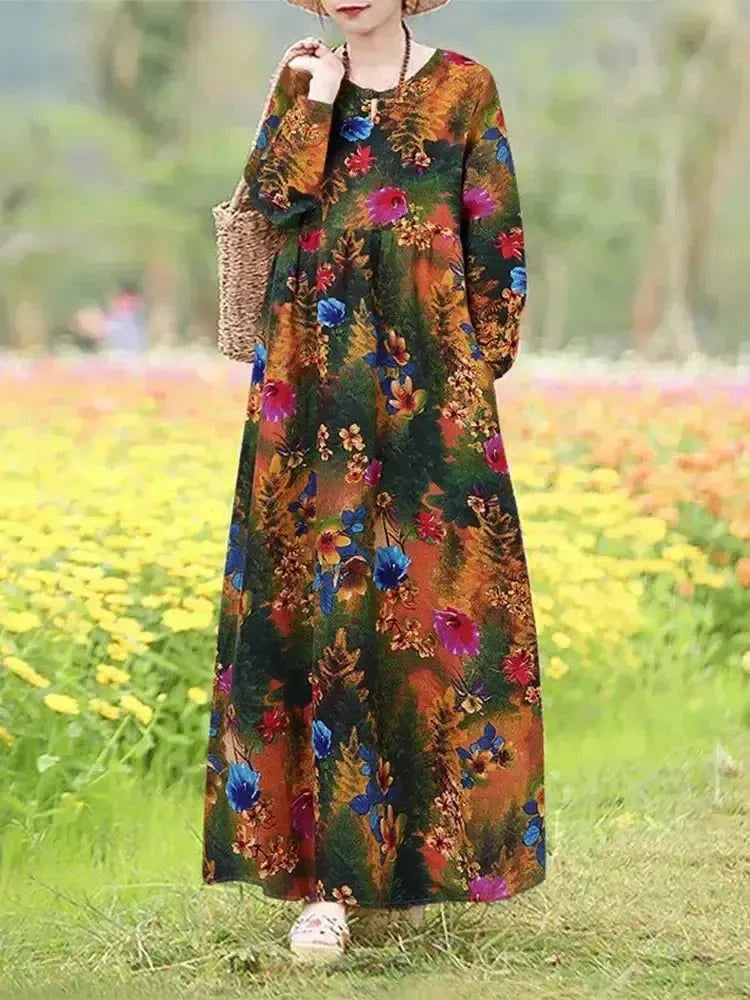 Giorgia vintage floral printed dress by Lumina Vancouver, blue fabric with colorful floral pattern, sleeveless design.