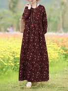 Giorgia vintage floral printed dress by Lumina Vancouver, blue color, sleeveless design, styled with a fitted waist and flowing skirt.