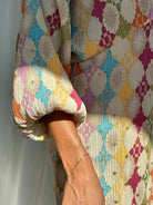 Colorful relaxed fit two-piece casual set by Lumina Wear, featuring a stylish top and matching pants for a comfortable look.