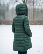 Dark green Lumina Wear fleece-lined puffer jacket featuring a flattering fit and elegant style, ideal for cold weather.
