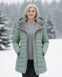 Dark green Lumina Wear fleece-lined puffer jacket named Grace, featuring a flattering fit and stylish design for cold weather.