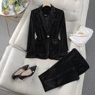 Red women's tailored blazer and trousers set by Lumina Wear, featuring a polished silhouette for sophisticated style.