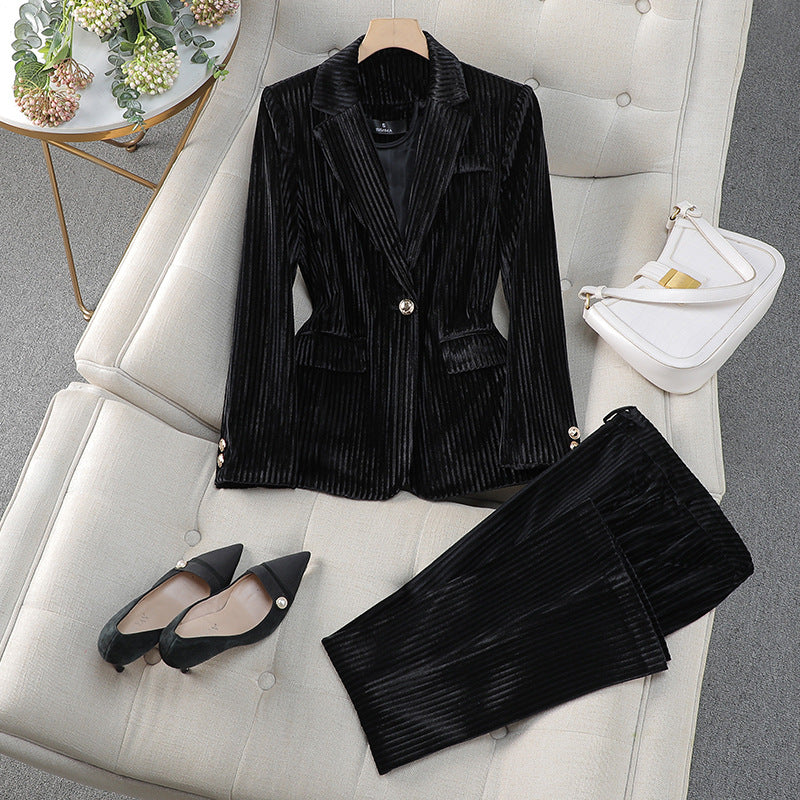 Red women's tailored blazer and trousers set by Lumina Wear, featuring a polished silhouette for sophisticated style.