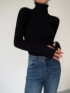 Dark brown Lumina Wear Hailey minimalist turtleneck top, showcasing a sleek winter-ready design with a close-up of the fabric and fit.