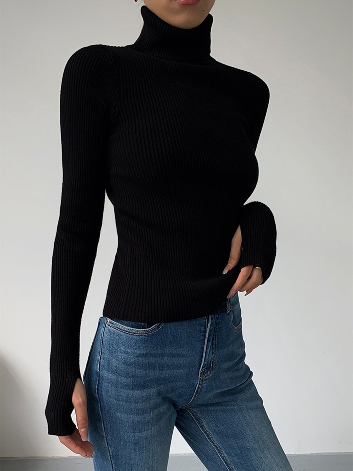 Dark brown Hailey Lumina Wear minimalist turtleneck top for winter, shown on a model, showcasing sleek and elegant winter style.