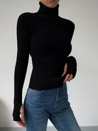 Dark brown Hailey Lumina Wear minimalist turtleneck top for winter, shown on a model, showcasing sleek and elegant winter style.