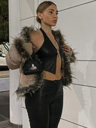 Black halter faux leather backless corset tank with metal ring hollow-out design from Lumina Vancouver.