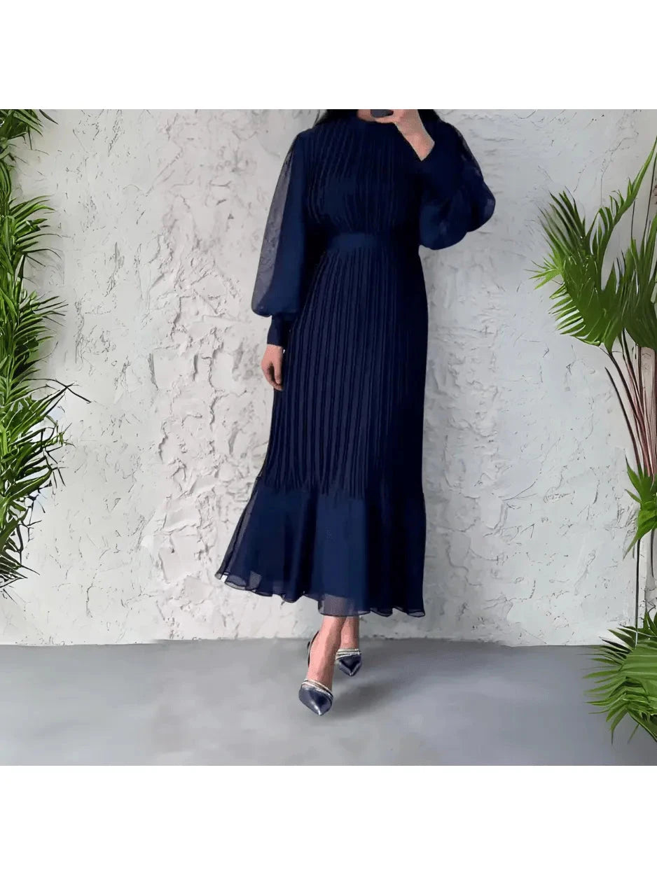 Blue Hannah™ pleated elegant dress by Lumina Vancouver, flowing fabric with a sophisticated design, perfect for formal occasions.