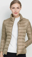 Harriet lightweight black puffer jacket with stand collar from Lumina Wear, shown in XS size with a sleek, padded design.
