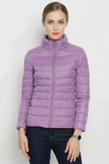 Black lightweight puffer jacket with stand collar from Lumina Wear, shown in XS size and matcha color.