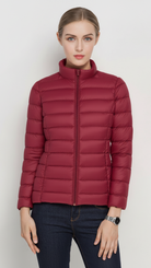 Harriet lightweight black puffer jacket with stand collar by Lumina Wear, shown in XS size with matching color.