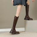 Elegant black knee-high boots with orthopedic support by Lumina Wear, featuring a brown fur lining for women.