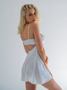 White silk satin Heidi nightdress by Lumina Vancouver, elegant sleepwear with smooth, luxurious fabric and delicate design.