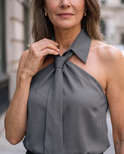 Lumina Wear Luna sleeveless halter blouse with neck tie, featuring lightweight fabric and stylish design, shown on a model.